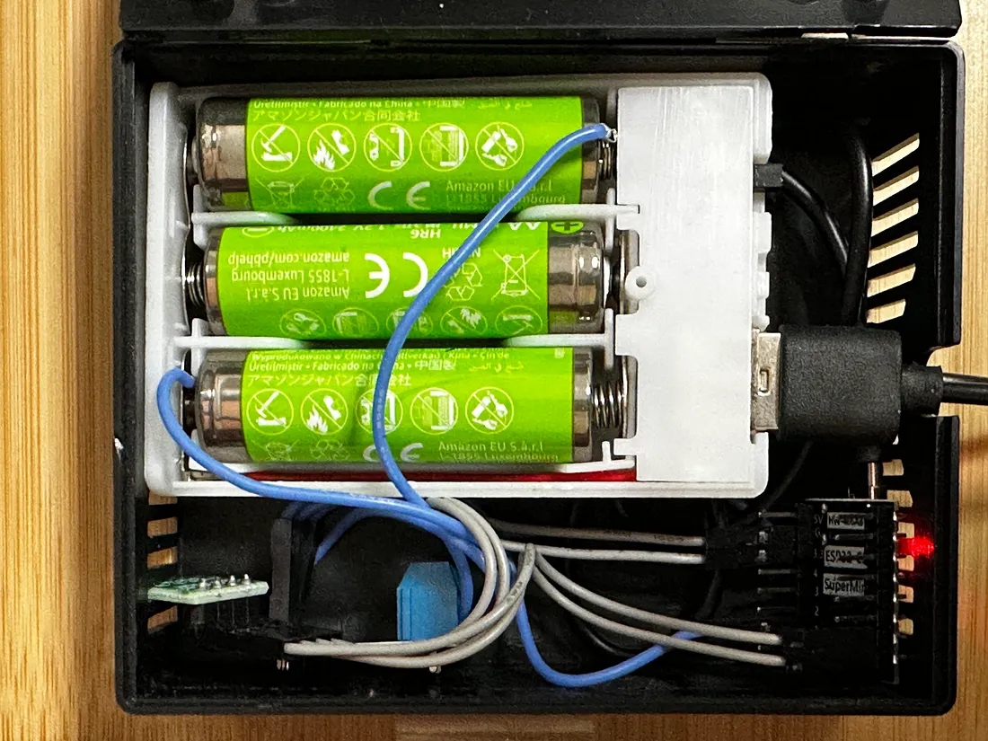 The internal of one of the battery-powered ESP32-based temperature and humidity sensor device fleets